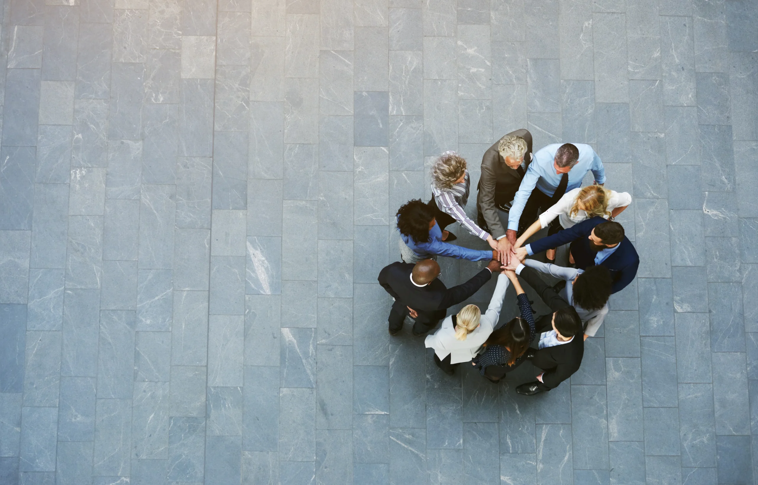 team-hands-together-in-corporate-office-building-2026-03-09-04-59-59-utc